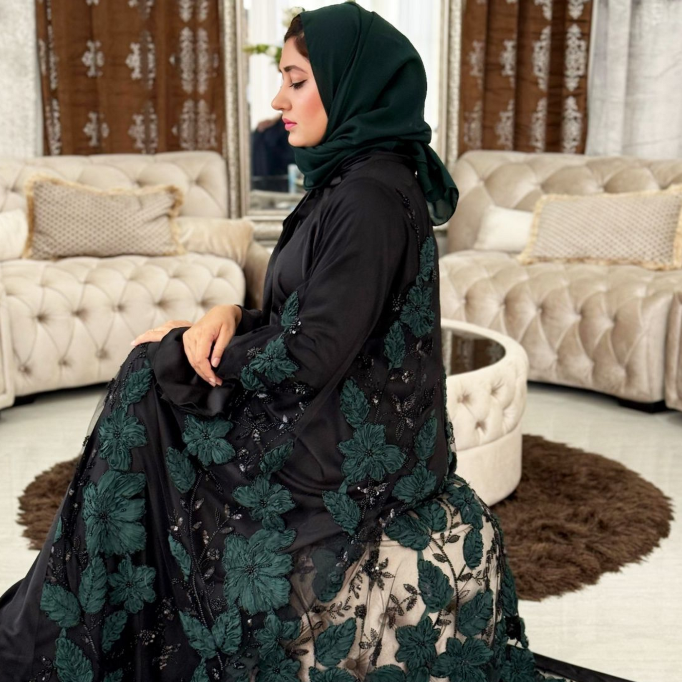Luxurious silk maxi paired with feather-pattern cape